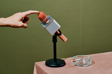 man testing a microphone in a desktop stand