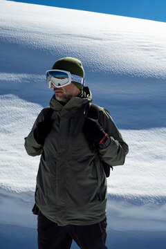 Man in ski goggles in highlands in winter