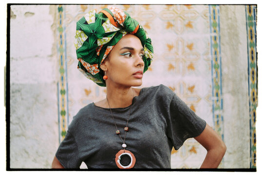 Proud modern woman portrait with African print turban