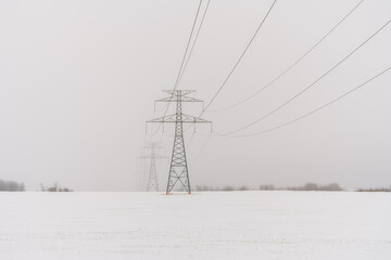 Electricity pylons in winter freezing weather 