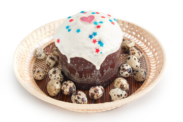 Easter cupcake and quail eggs in a wicker basket