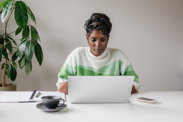 Portrait of a confident business woman working at a desk