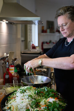 Homecook preparing rice noodle salad