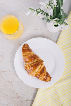 A croissant on a plate