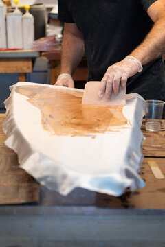 Fibreglass Cloth and Epoxy Resin on Teak Centerboard of Sailboat