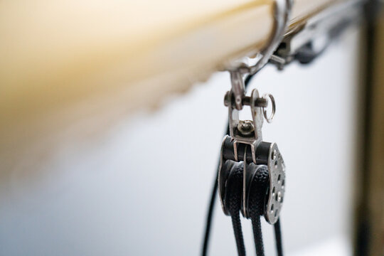 Boom Vang Rigging Detail of Dinghy Sailboat on Lake in the Rain