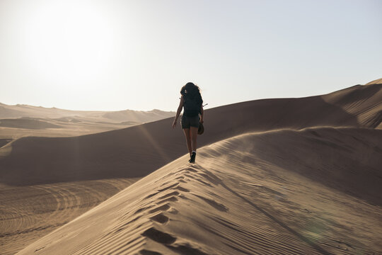 Woman walking in desert
