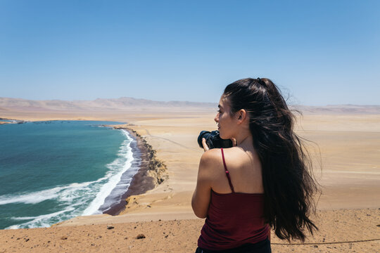 Young woman taking photos