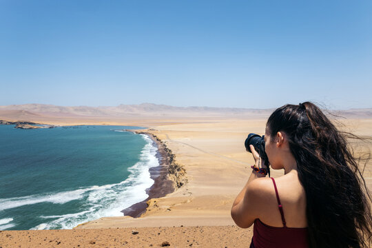 Young woman taking photos