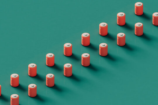 rows of Pink rechargable batteries on a green background. 