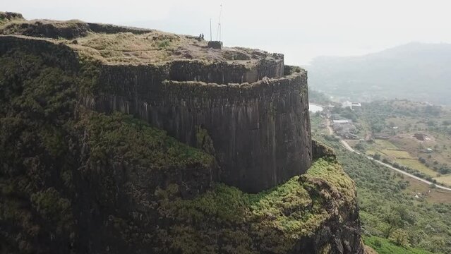 Aerial rotates around Vinchu Kada end of ancient Indian Lohgad fort