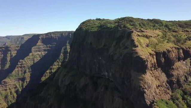 Elphinstone viewpoint in Maharashtra India atop tall green rock cliff