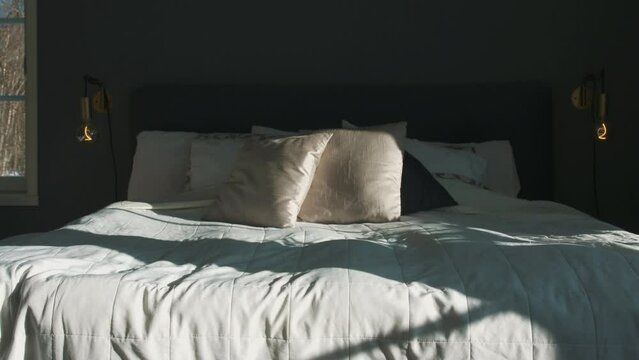 Motion Time Lapse Of Sunlight And Shadow moving on luxurious empty bed