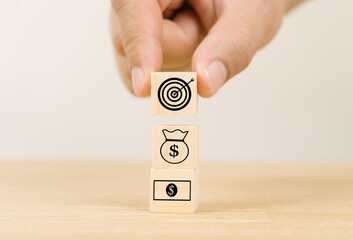 Hand arranging wood block with icon save money concept, copy space,Saving, financial, banking,...