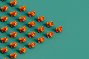 collection of Orange megaphones on green. 3d render
