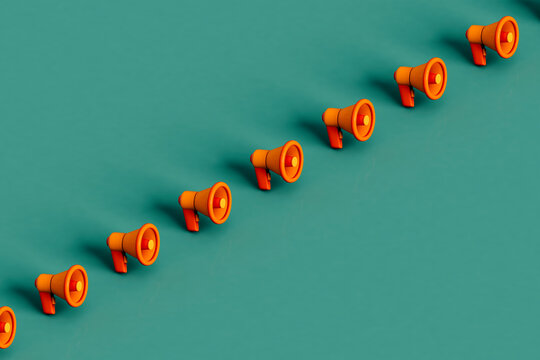 a row of Orange megaphones on green. 3d render