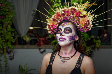 Young woman with sugar skull makeup. Catrina portrait.