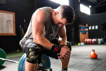 Athlete resting during weightlifting workout