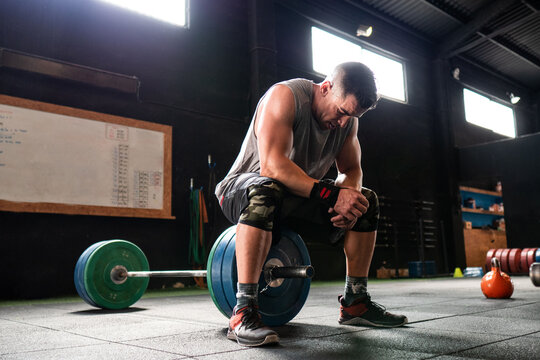 Athlete resting during weightlifting workout