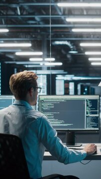 Vertical Screen. Information Technology Specialist and Data Center Administrator Working on Personal Computer, Monitoring Web Services, Cloud Computing, Analytics Facility, Cyber Security