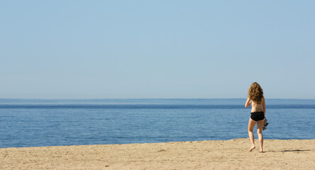Fototapeta na wymiar Young woman alone on Venice Beach, California, USA