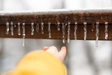 Touching an icicle
