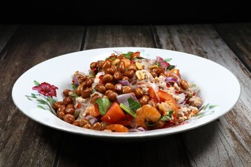 Traditional spicy fresh vermicelli or glass noodle with mince pork and roasted peanut serving on the plate. Famous street food menu in Thailand.