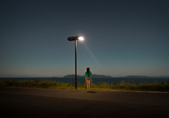 Standing woman on dreamlike lookout