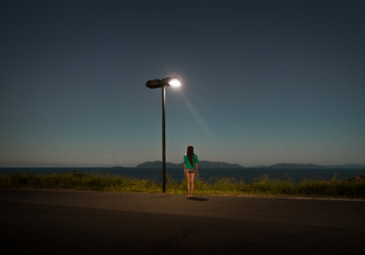 Standing woman on dreamlike lookout