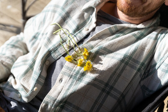 Young man relaxing and sunbathing on hammock