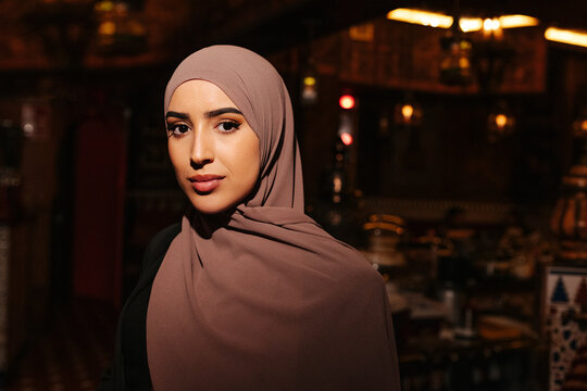 Young muslim woman in traditional arab tea house