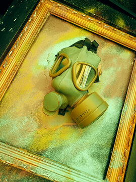 Gasmask within golden frame