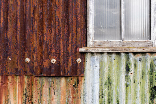 Rusty metal sheets and window