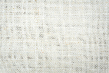 Jute hessian sackcloth burlap canvas woven texture background pattern in light beige cream brown color design element.