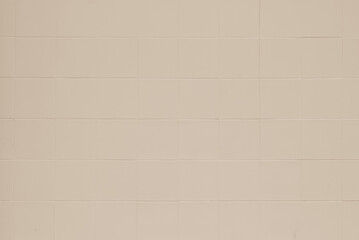 Cream ceramic wall and floor tiles mosaic abstract background. Beige tile geometric wallpaper texture design element.