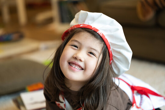 Happy child in baker hat