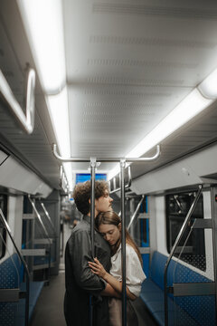Hugs and tenderness of a couple in love in the subway