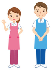 エプロンをつけた男女　挨拶する介護士　スタッフ