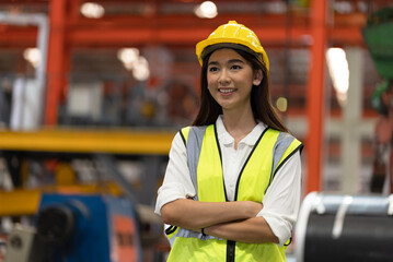 Portrait happy woman engineer or foreman hard work with machine at factory