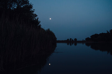 Night landscape with lake and moon