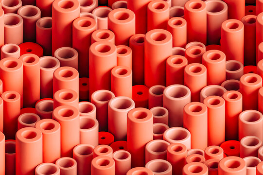 Three dimensional pattern of rows of red colored cylinders