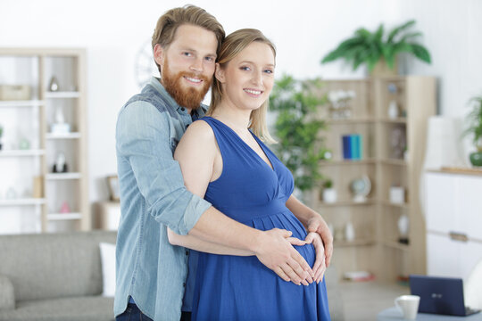 pregnancy and lovely couple at home