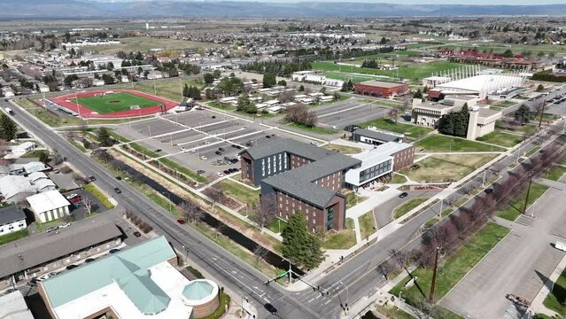 Cinematic 4K aerial drone footage of the Central Washington University athletic fields and Purser Building in Ellensburg, Kittitas County in Western Washington