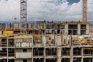 Monolithic frame construction of the building. Workers working at the construction site at home. The framework for the walls. Formwork for walls made of concrete. construction site close up.
