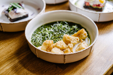 Crispy cauliflower with pesto. close-up