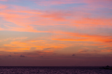 Beautiful view of the sea and the sky in the clouds at sunset. Orange red dawn, dusk on the sea...