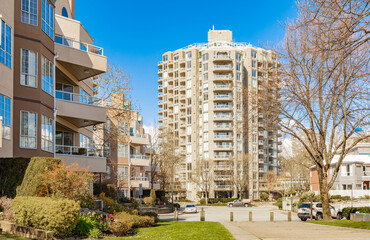 Neighborhood modern houses with spring flowers in BC, Canada. Canadian modern residential architecture.