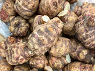 Jerusalem artichoke root fruit healthy meal food diet snack on the table copy space food background rustic top view keto or paleo diet veggie vegan or vegetarian food