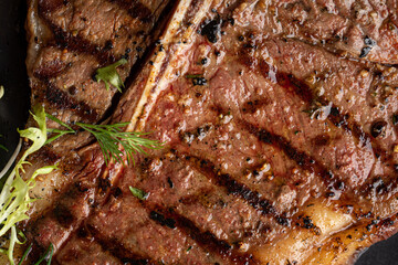 Obraz na płótnie Canvas Closeup on juicy grilled beef steak texture background