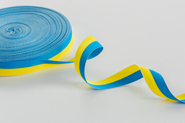 Yellow blue ribbon in a skein. Ribbon in the colors of the flag of Ukraine. Sewing tape